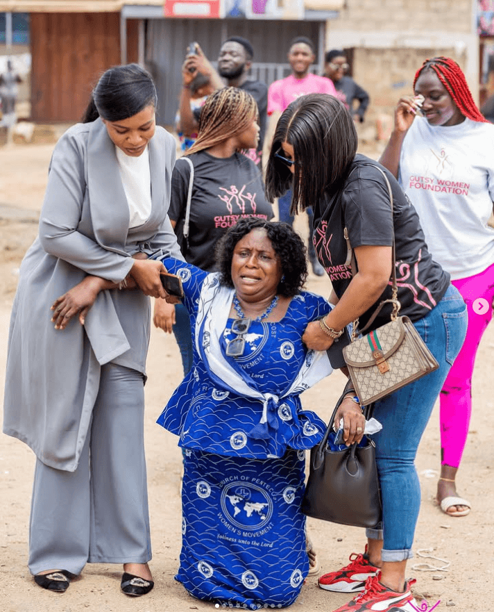 Gutsy Women Foundation members supporting a woman at a community outreach